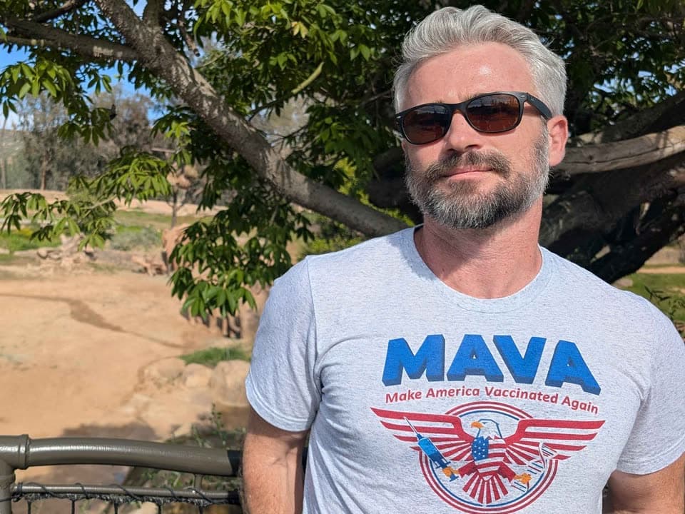 Dr. Greg wearing the MAVA, Make America Vaccinated Again, shirt