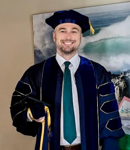 Dr. Gregory M. Newkirk in UC Riverside doctoral regalia